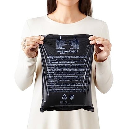 Amazon Basics - Bolsas para excrementos de perro sin perfume con dispensador y clip para correa, estándar de 33 x 22 cm, color negro, 600 bolsas (40 rollos)
